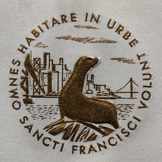 A seal on a piece of paper depicting a seal (well, a sea lion) in front of the San Francisco skyline circa maybe 1965. The Latin surrounding it reads 'OMNES HABITARE IN URBE VOLUNT'